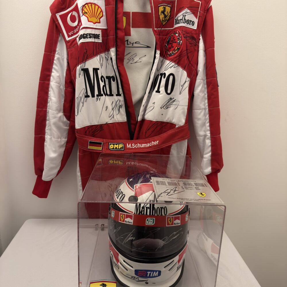 Schumacher multi signed suit and helmet