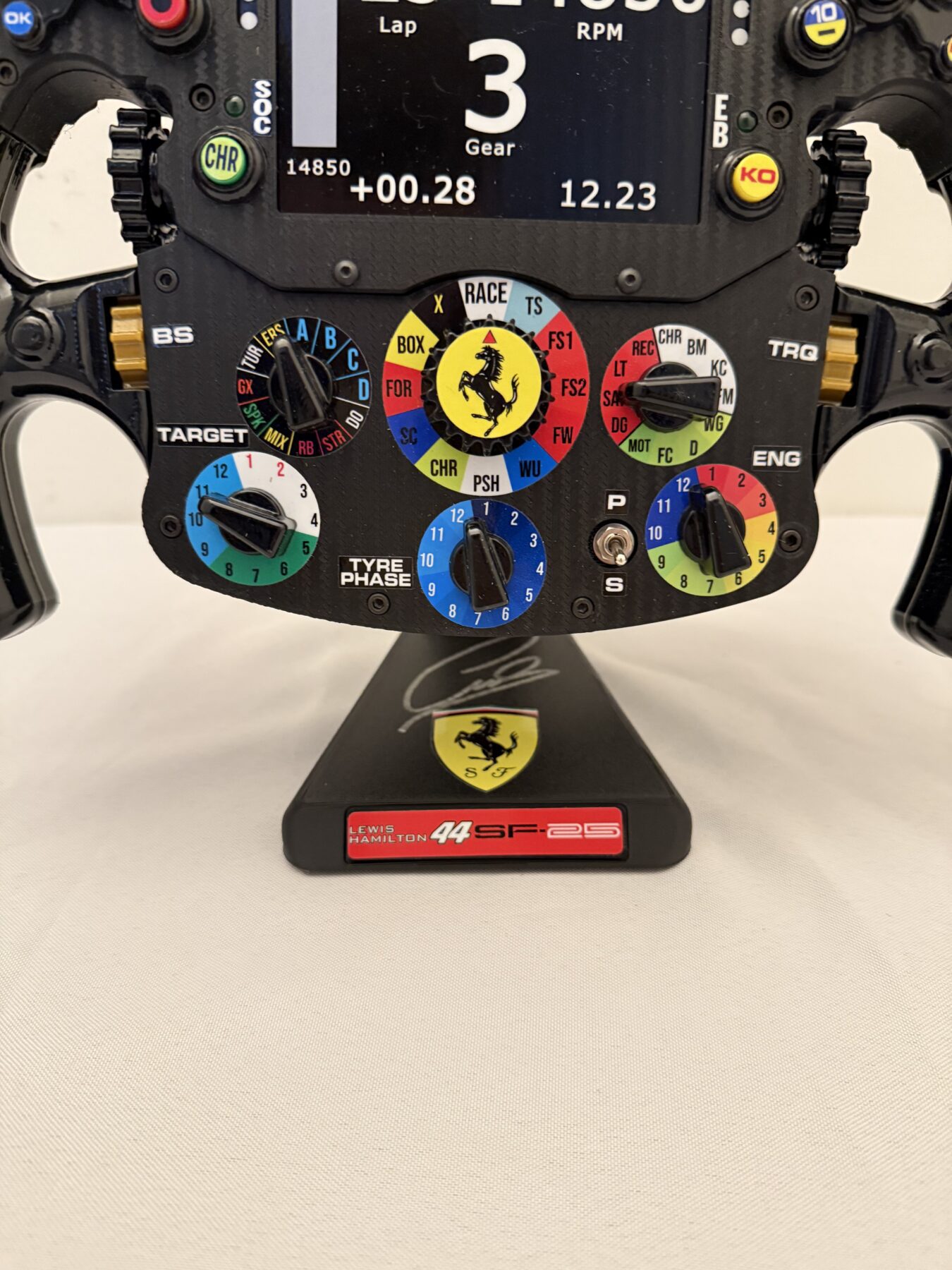Lewis steering wheel signed on the stand