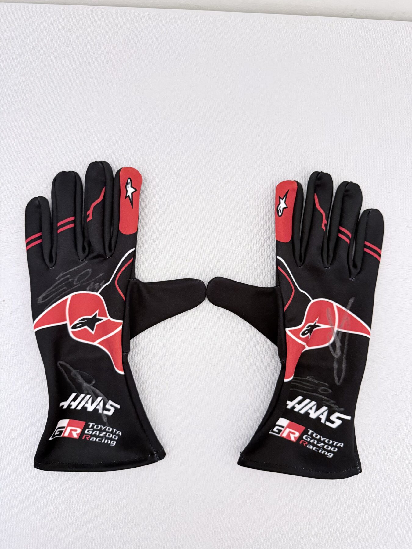 Esteban Ocon & Oliver Bearman Signed gloves